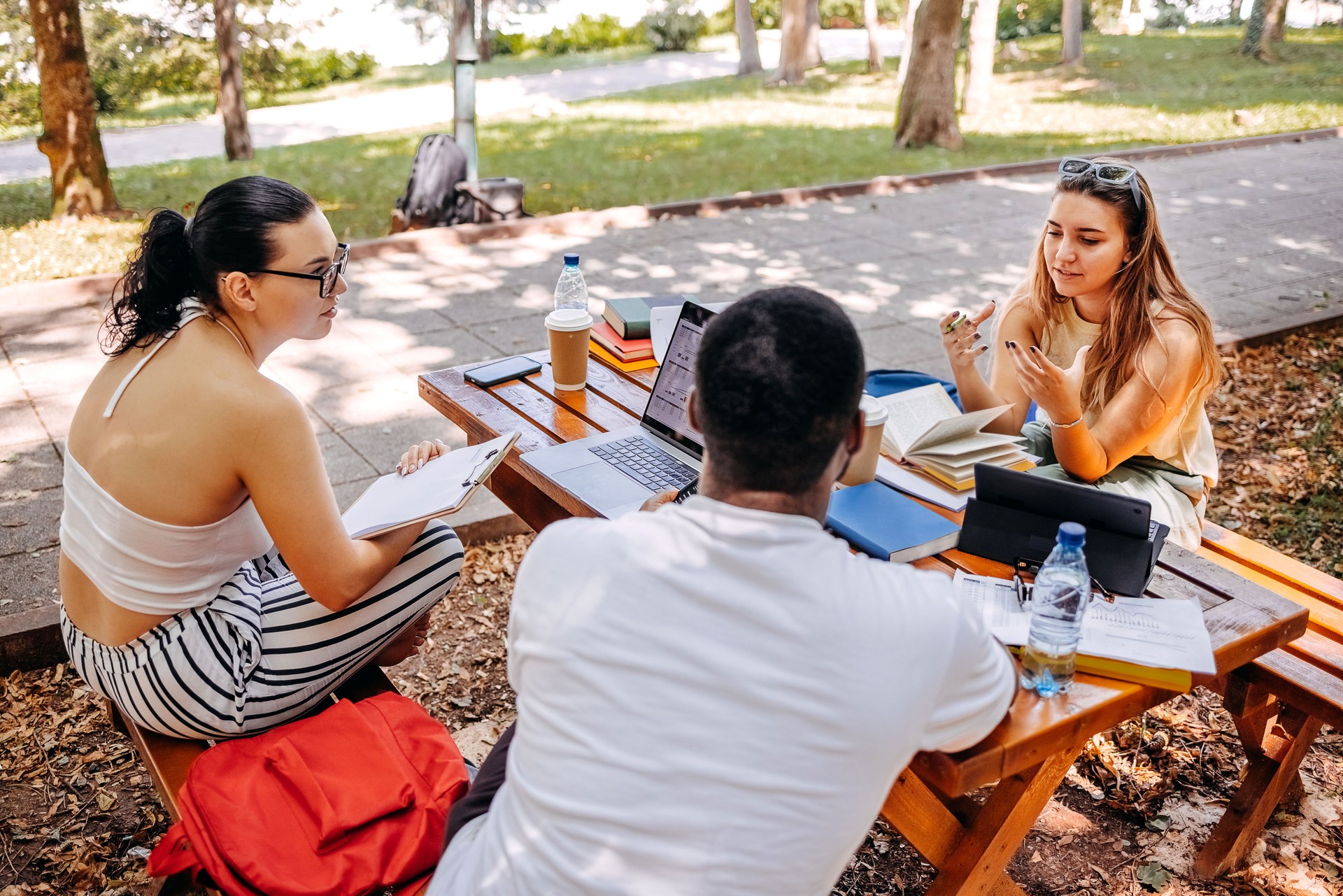 Group of students learning outside in public park